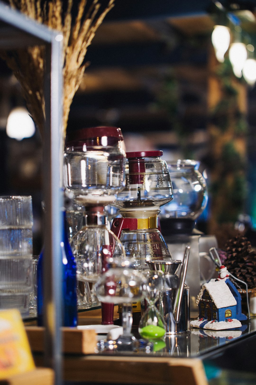 Glass jars and coffee brewing equipment on a shelf.